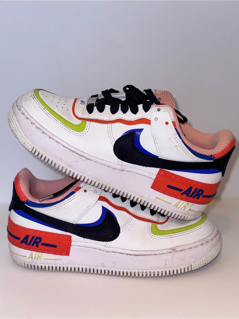 Nike White Sneakers with Black Swoosh and Multi-Color Accents